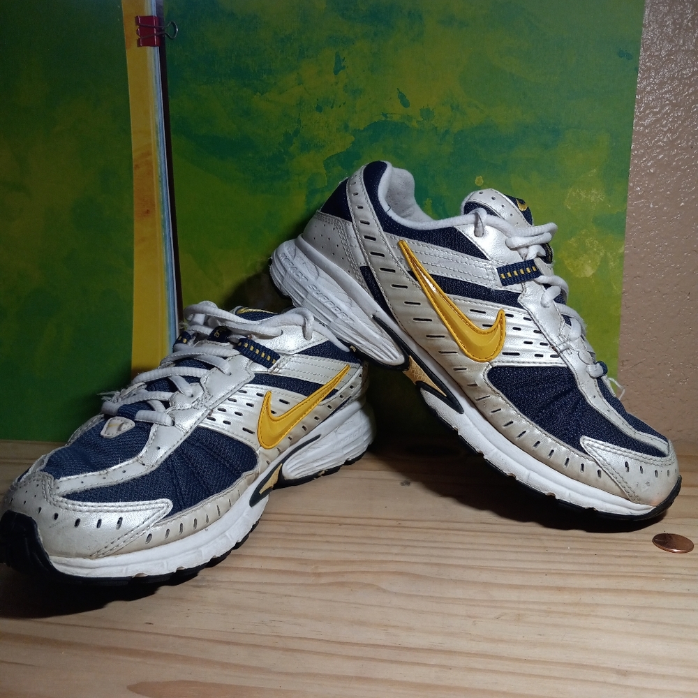 Nike running shoes blue and gold sizes. 8.5